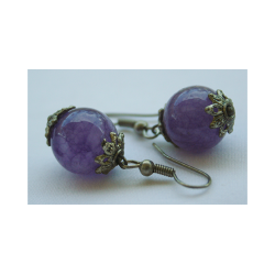 reringe med perle af sten i mrk lilla