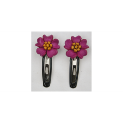 Hrspnder med lder blomst i pink med gule stvfangere. 